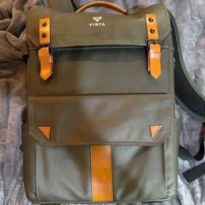 Like new Olive Green canvas/leather Backpack by Vinta with dust bag.